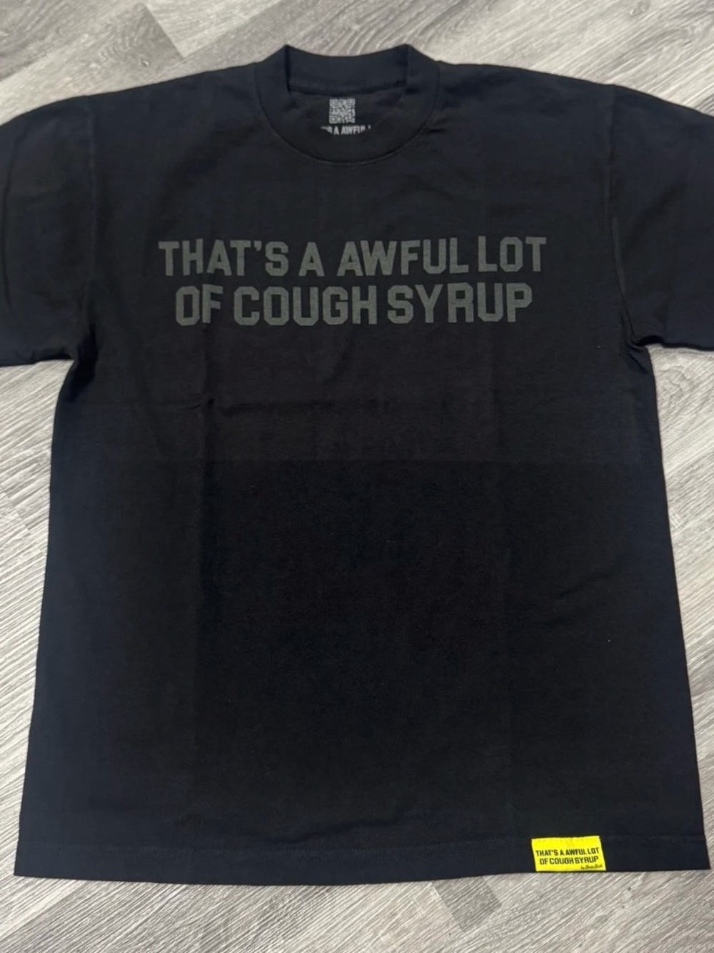 Black Graphic Tee with 'That's A Awful Lot Of Cough Syrup